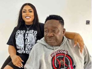 The late John Okafor "Mr. Ibu" and his adopted daughter. Photo Courtesy